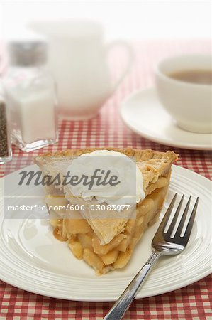Apple Pie with Whipped Cream on Plate