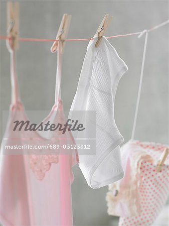 Pale pink nightdress and shorts at a clothesline