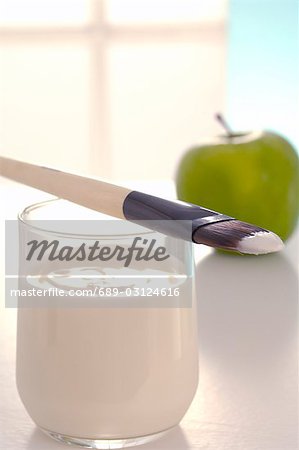 Facial mask with yoghurt,an apple and a brush