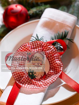 Serviette de table décoré avec une plaquette de Santa Claus