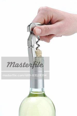 Open wine bottle with a waiter's corkscrew