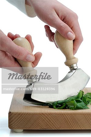 Cutting herbs with a mincing knife