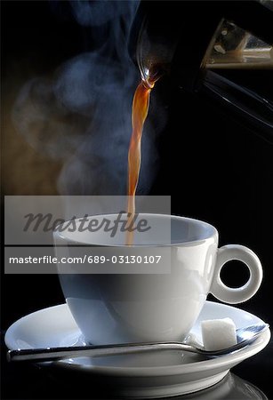 Pouring coffee into a cup Pouring coffee into a cup