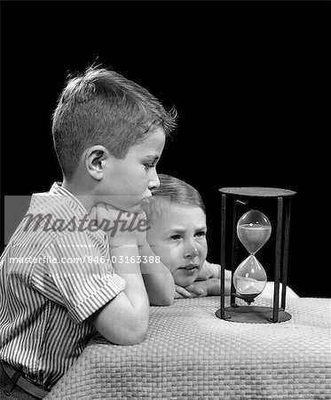 1940s TWO BOYS LOOKING HOURGLASS TIME SAND WAITING