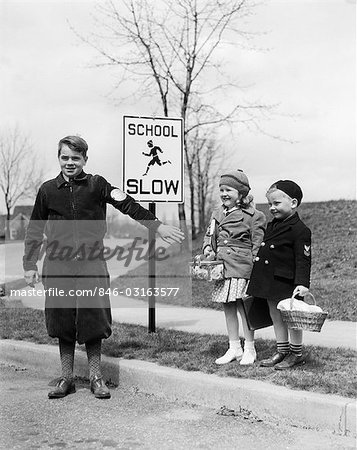 1930s TWO CHILDREN BOY GIRL WAITING TO CROSS STREET CROSSING GUARD