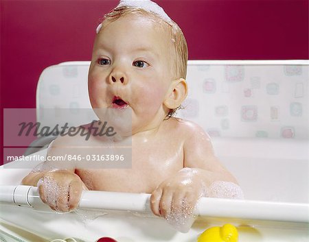 1960s WET BABY IN BATH MAKING FUNNY FACE