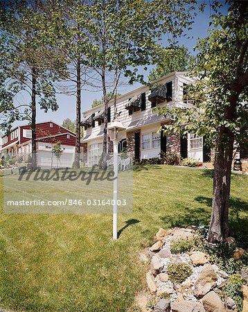 1970s TWO HOUSES LANDSCAPED LAWNS AWNINGS ON WINDOWS SUBURBAN NEIGHBORHOOD RESIDENTIAL COMMUNITY