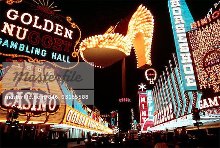 1970s MONTAGE OF NEON CASINO LIGHTS ON FREMONT STREET DOWNTOWN LAS VEGAS NEVADA AND THE FAMOUS GOLDEN SLIPPER SHOE