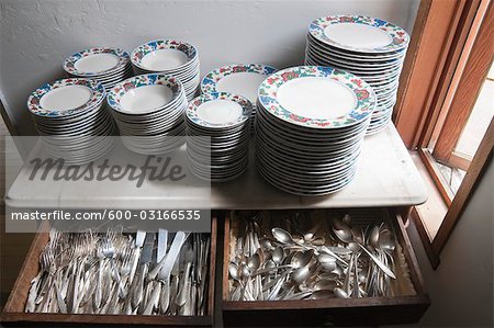 Antique Dishes and Cutlery on Stone Table