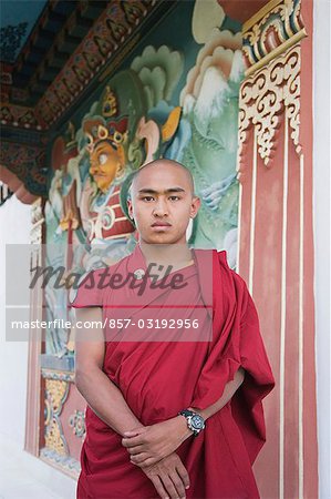 Monk standing in a temple, Bhutan Temple, Bodhgaya, Gaya, Bihar, India