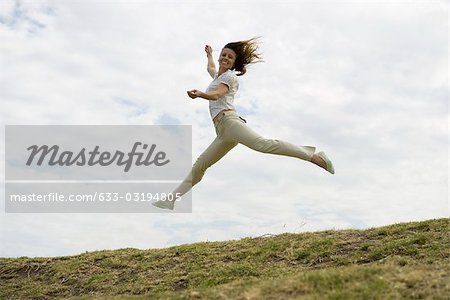 Woman jumping, midair