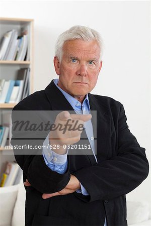 Angry senior man pointing finger