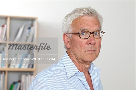 Pensive senior man wearing glasses