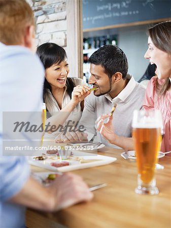 Group of Friends Enjoying Drinks and Appetizers at Wine Bar, Toronto, Ontario, Canada