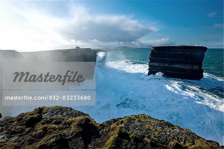 Downpatrick Head, Co Mayo, Ireland;  Cliff and seastacks at the Atlantic Ocean during a winter swell