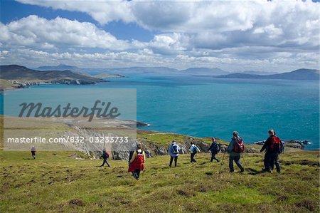 Menawn Cliffs, Achill Island, Co Mayo, Ireland; Hikers descending the Menawn Cliffs