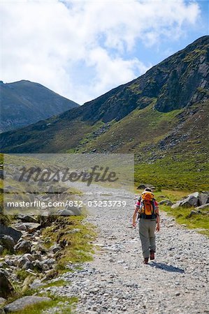 Mourne Mountains, Co Down, Ireland;  Hiker on the Trassey Track