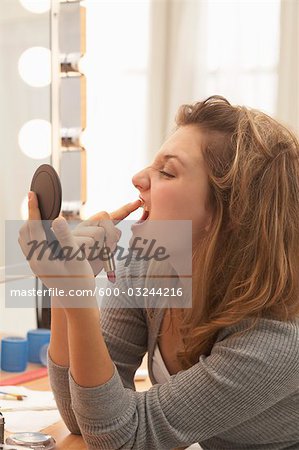 Close-up of Teenager Applying Make-up