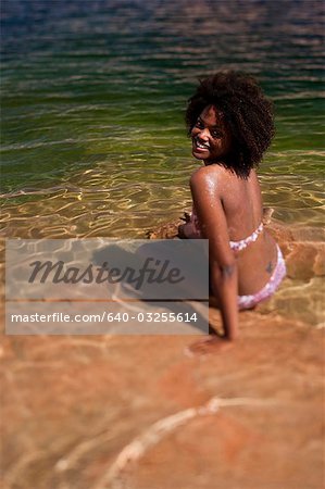 Woman resting in shallow water