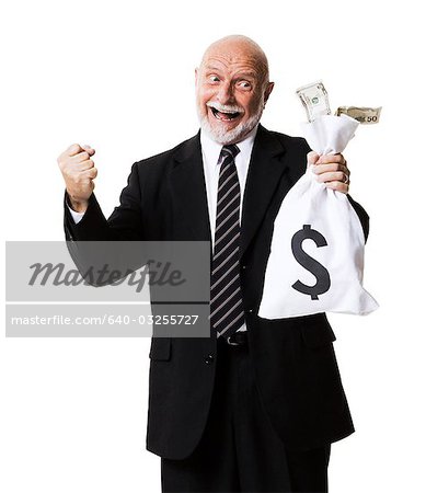 Portrait of businessman holding money and money bag