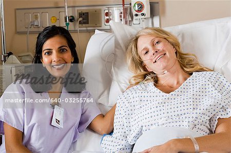 Woman in hospital bed smiling