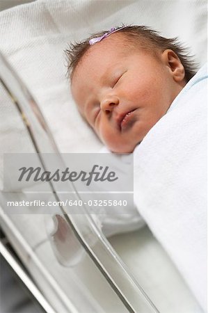 Newborn girl in incubator