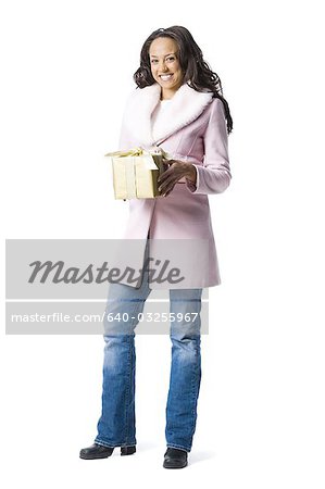 Woman standing with Christmas gifts