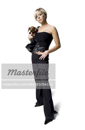 Woman with a small dog in her purse