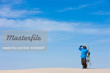 USA, Utah, Little Sahara, man with skiwear standing in desert