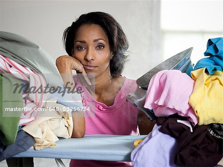 Orem, Utah, USA, mid adult woman ironing