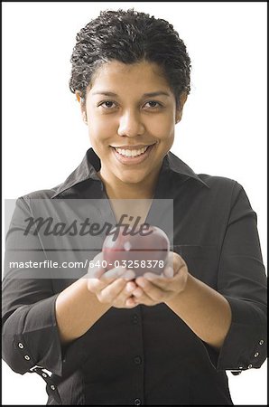 Female teacher standing in front of a blackboard