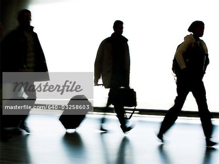 Silhouette of man with bag