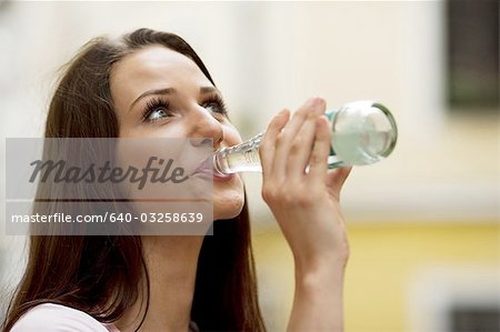 Woman drinking a bottle of water