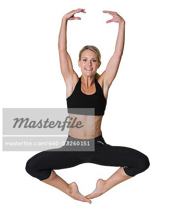 Woman jumping with outstretched arms