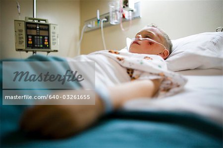 Boy sleeping in hospital bed