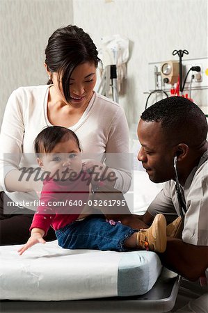 Mother and baby in examining room with doctor