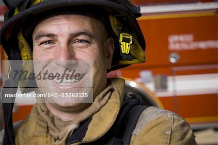 Fire fighter in uniform with Crossed Arms