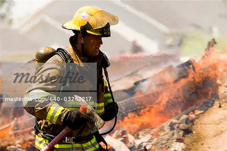 Portrait of a firefighter with axe