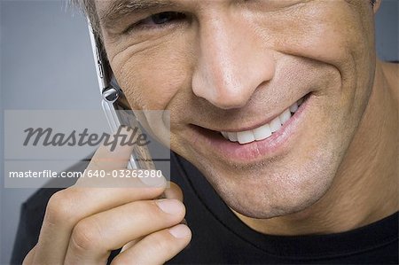 Closeup of man talking on cell phone