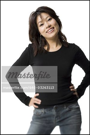Woman standing with arms crossed smiling