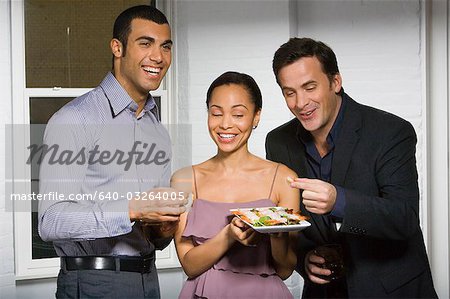 Partygoers eating