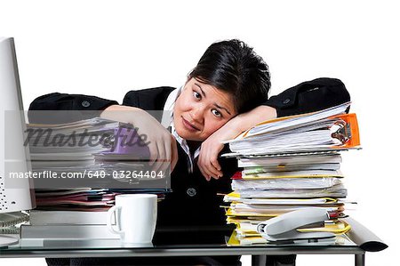 Woman with stack of binders