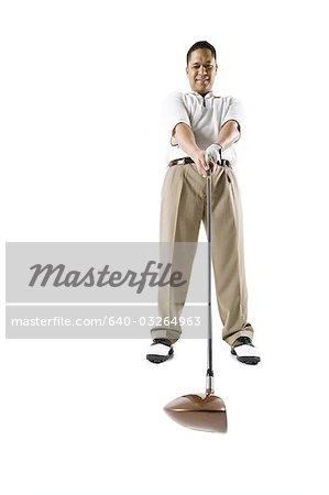 Golfer swinging club