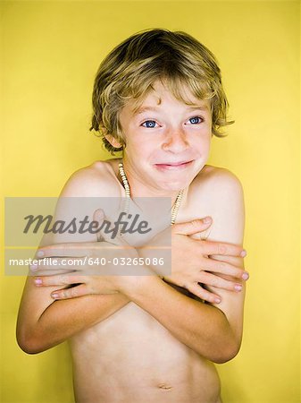 Smiling shirtless boy