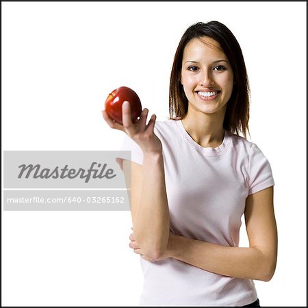 Woman holding a red apple