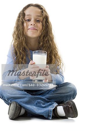 Young girl with a glass of milk