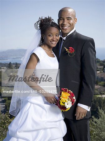 Portrait of a newlywed couple smiling together