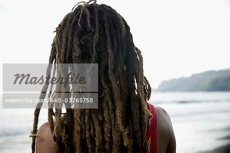 Rear view of a young man on the beach