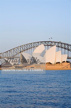 View across Sydney harbour to the iconic Opera House and Harbour Bridge