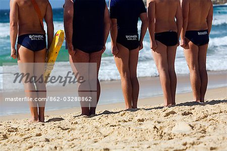 Members of the Bondi Surf Bathers Life Saving Club stand at the ready during a training drill on the iconic Bondi Beach.